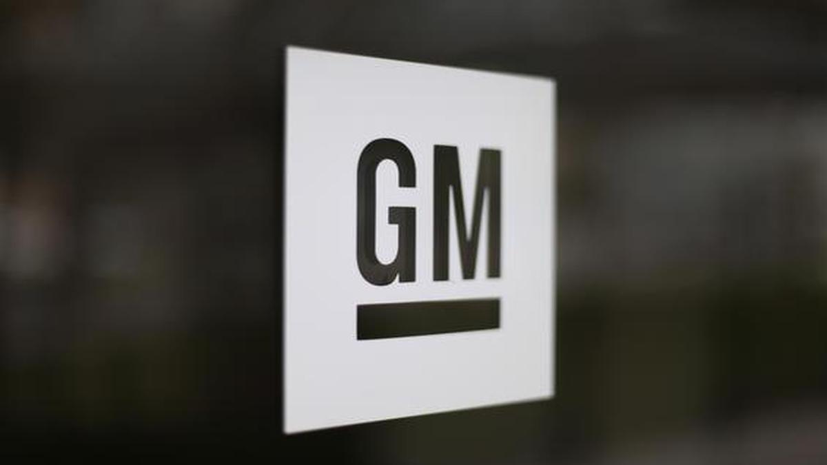 GM hit by chip shortage, to cut production at four plants