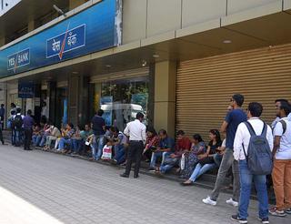 In pics: Customers of Yes Bank line up outside ATMs for cash fearing loss  of deposits