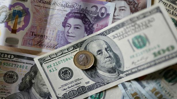 Sterling turns positive as dollar wavers and PM Truss defends economic plans