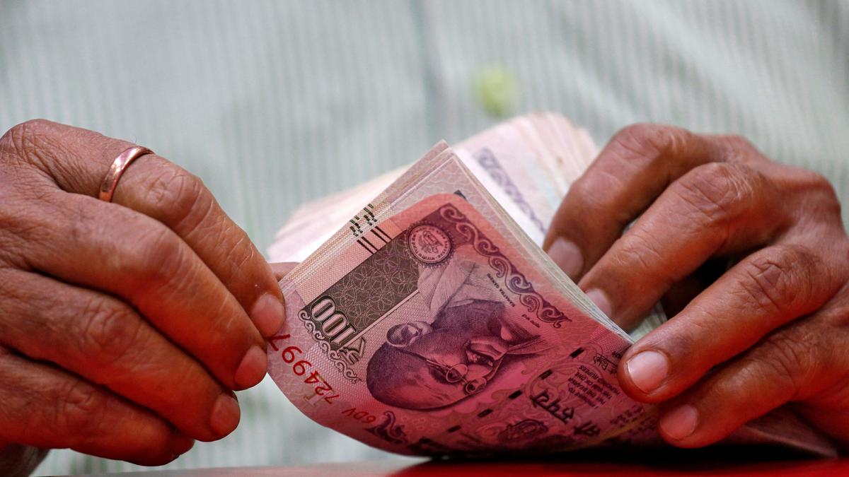 Rupee surges 22 paise to settle at 87 against U.S. dollar