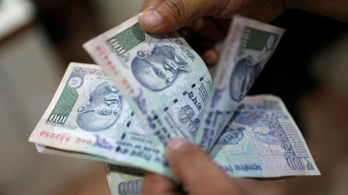 Rupee gains 12 paise to close at 74.30 against U.S. dollar