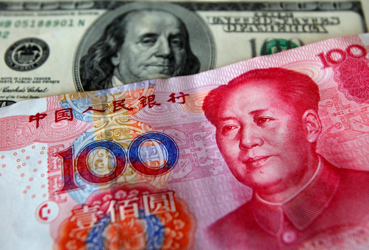 China's yuan extends slide, stocks rebound after fire sale
