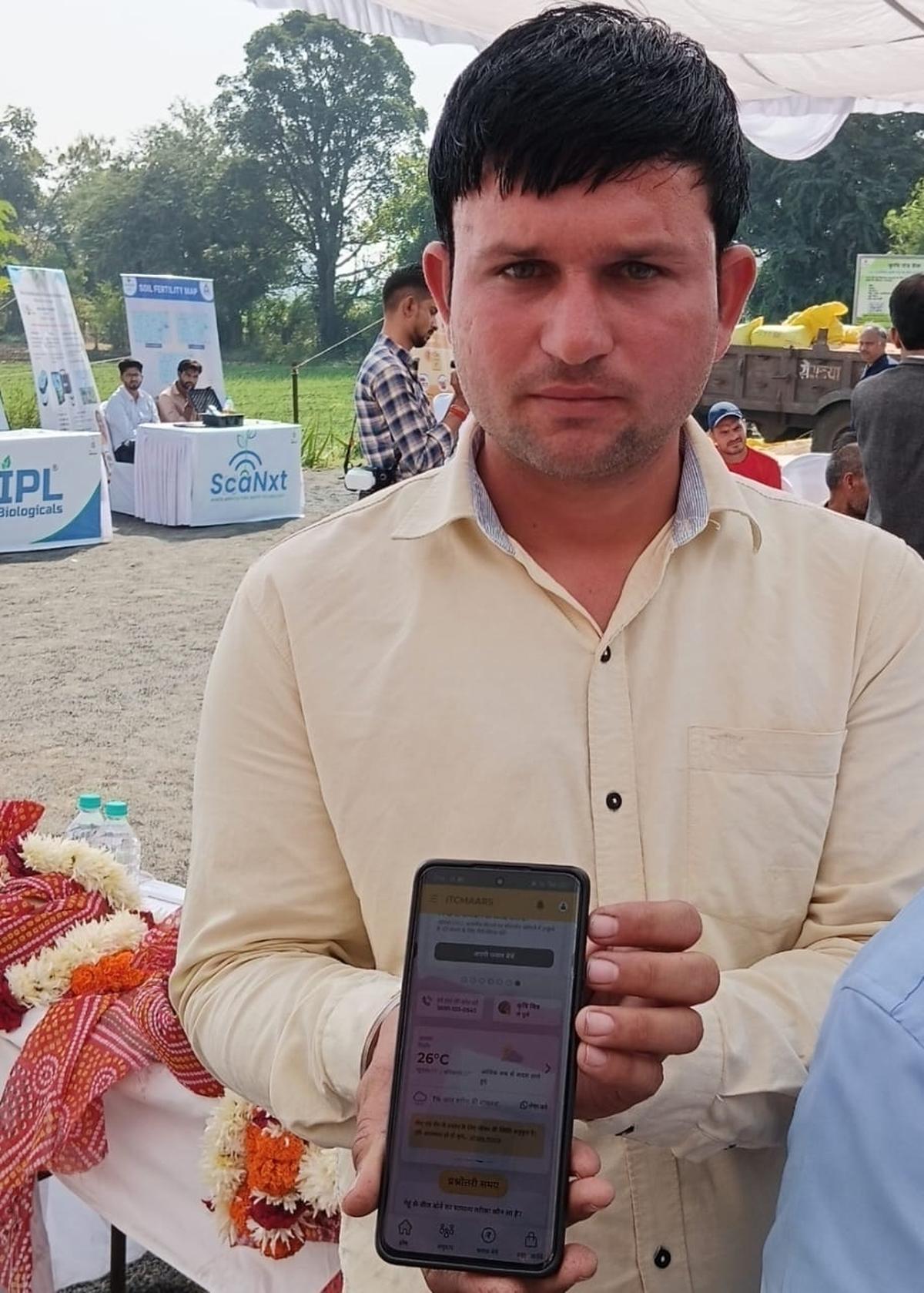 A farmer in Sehore district of Madhya Pradesh displaying the ITCMAARS app on his mobile phone. A farmer in Sehore district of Madhya Pradesh displaying the ITCMAARS app on his mobile phone.