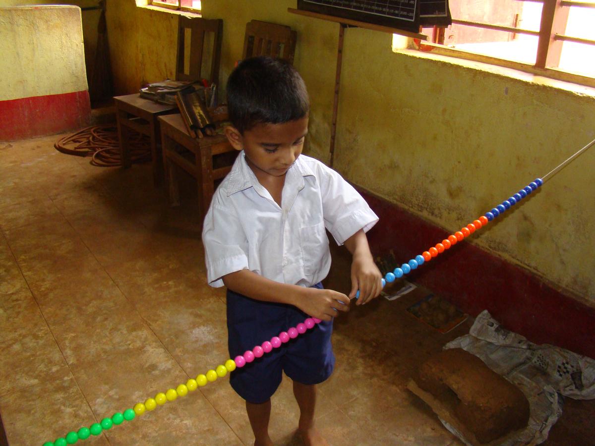 A child making a number. | Photo: Special Arrangement 