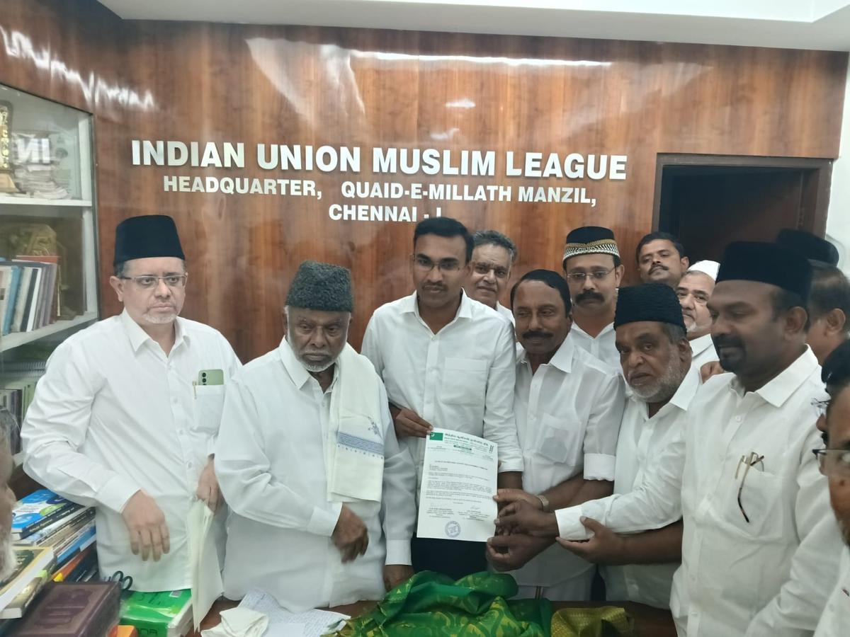 IUML national president K.M. Kader Mohideen hands over the party’s letter of support to TVK leaders on Saturday