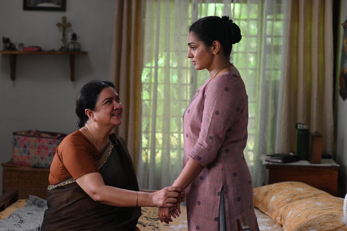 Urvashi and Parvathy in a still from ‘Ullozhukku’