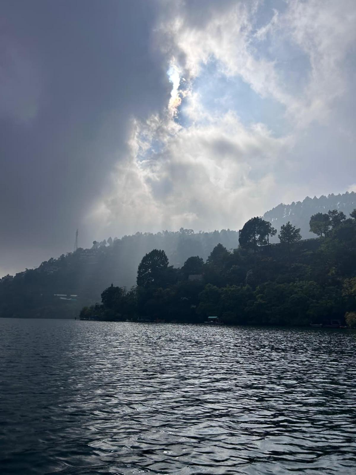 Paddling across the Naukuchiatal lake Paddling across the Naukuchiatal lake