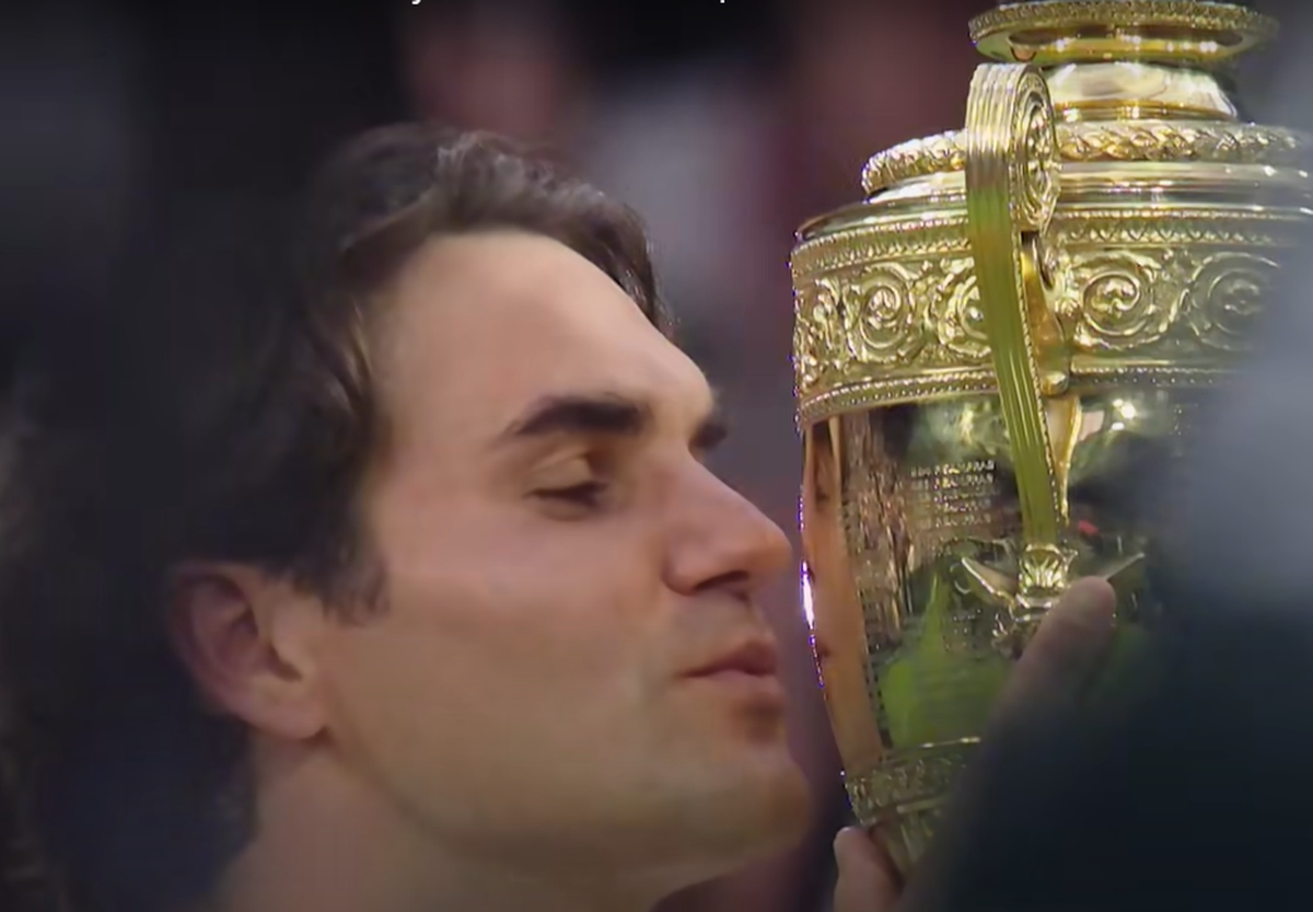 Roger Federer with the Wimbledon Trophy.