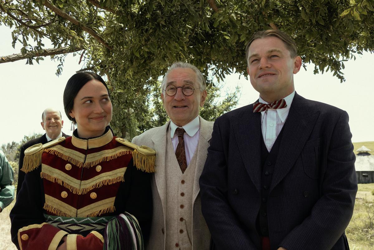 Lily Gladstone, Robert De Niro and Leonardo DiCaprio in a still from the film