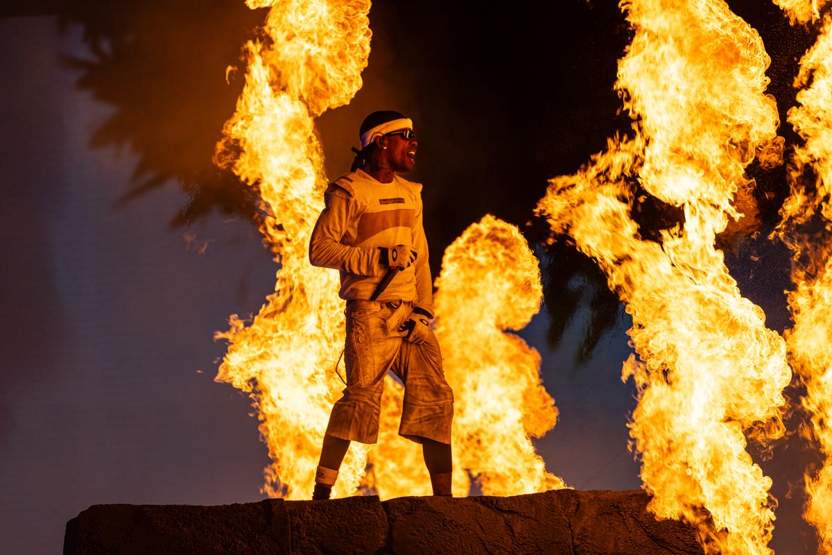 Travis Scott poses on stage during his Circus Maximus concert at Delhi’s Jawaharlal Nehru Stadium, on October 18, 2025