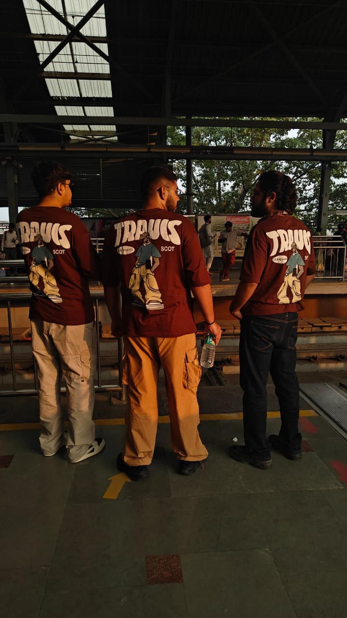Three fans await the metro to JLN Stadium ahead of Travis Scott’s Circus Maximus concert in Delhi on October 18, 2025 Three fans await the metro to JLN Stadium ahead of Travis Scott’s Circus Maximus concert in Delhi on October 18, 2025