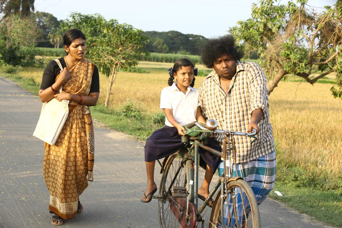 Subatra, Srimathi, and Yogi Babu in a still from ‘Bommai Nayagi’