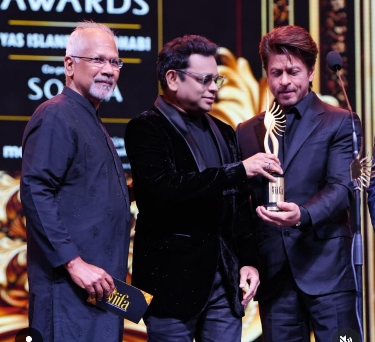 Mani Ratnam and A R Rahman present the Best Actor award to Shah Rukh Khan at the IIFA Awards 2024 at the Etihad Arena in Abu Dhabi