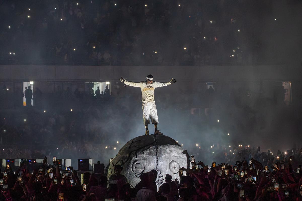 Travis Scott poses on stage during his Circus Maximus concert at Delhi’s Jawaharlal Nehru Stadium, on October 18, 2025