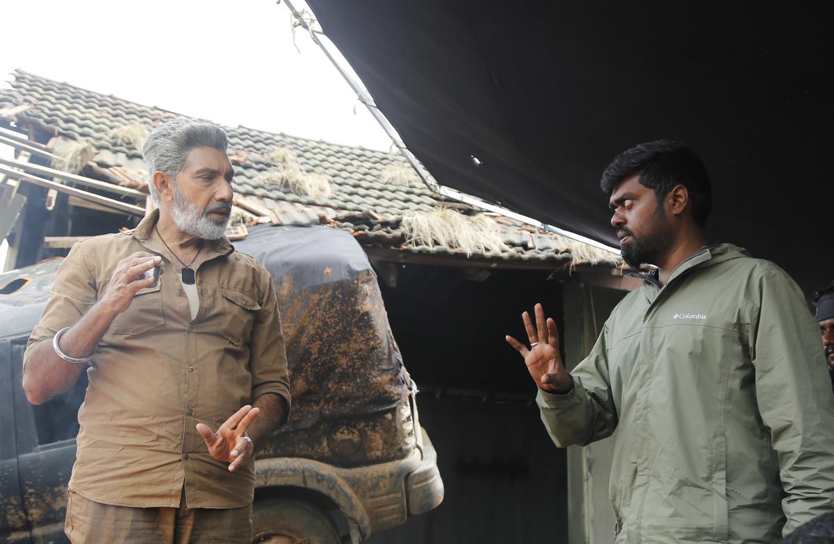 Sathyaraj and director Guhan Senniappan in a still from ‘Weapon’