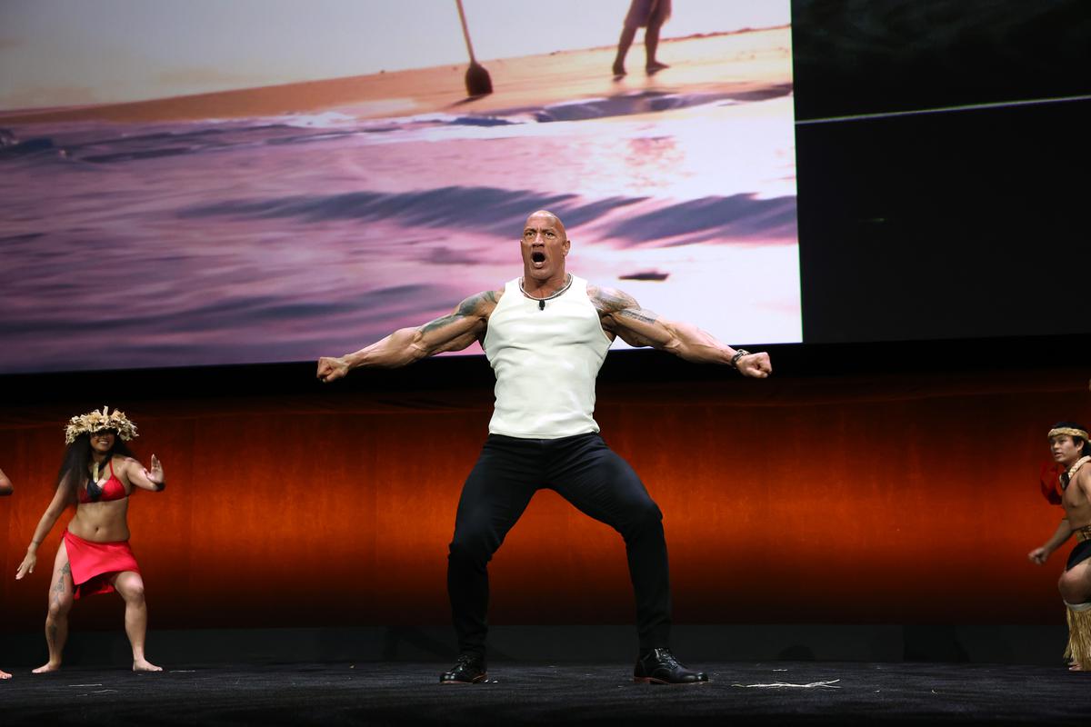 Dwayne Johnson performs onstage with dancers during the Walt Disney Studios presentation at Cinemacon in Las Vegas, Nevada on April 11, 2024