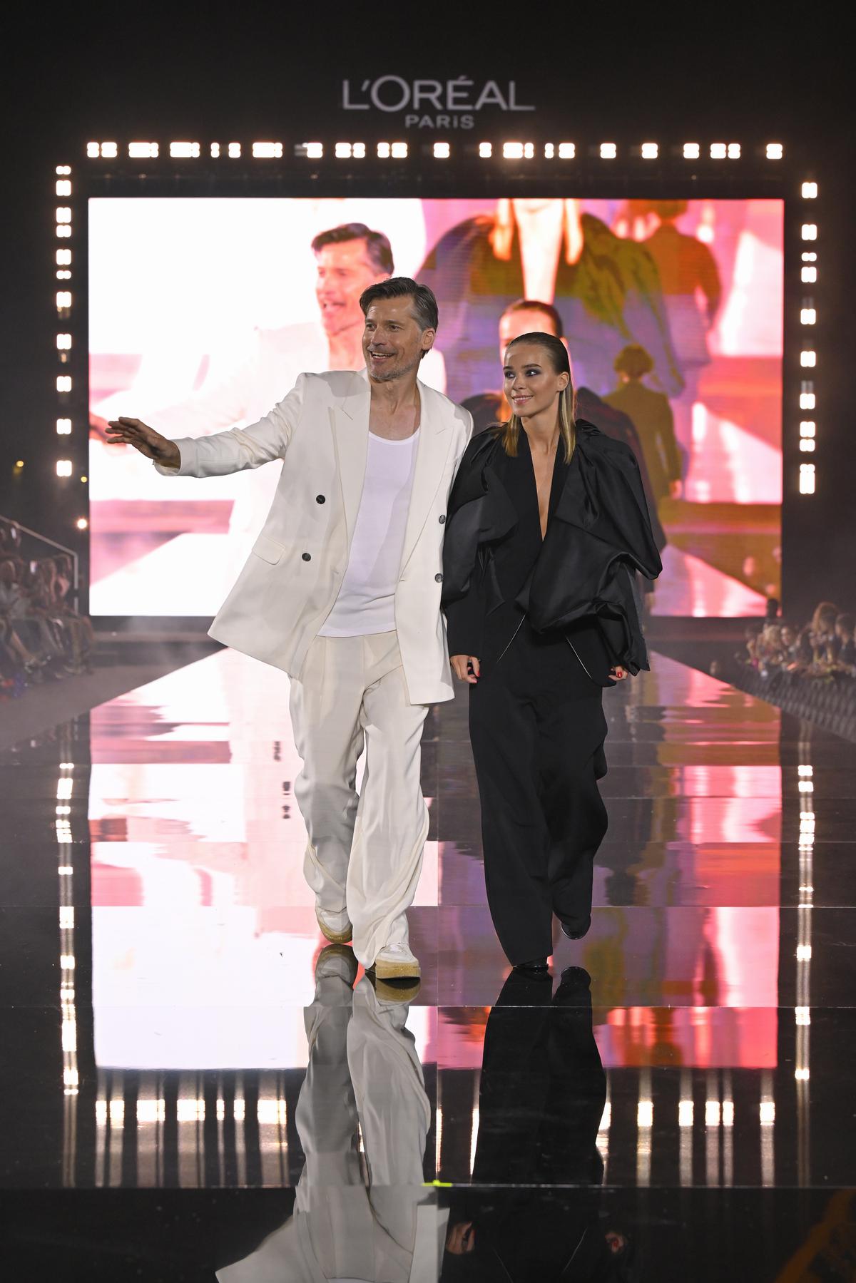 Nikolaj Coster-Waldau and Safina Waldau walk the runway during ‘Le Défilé L’Oréal Paris - Walk Your Worth’ show as part of Paris Fashion Week at the Eiffel Tower on October 01, 2023 in Paris, France