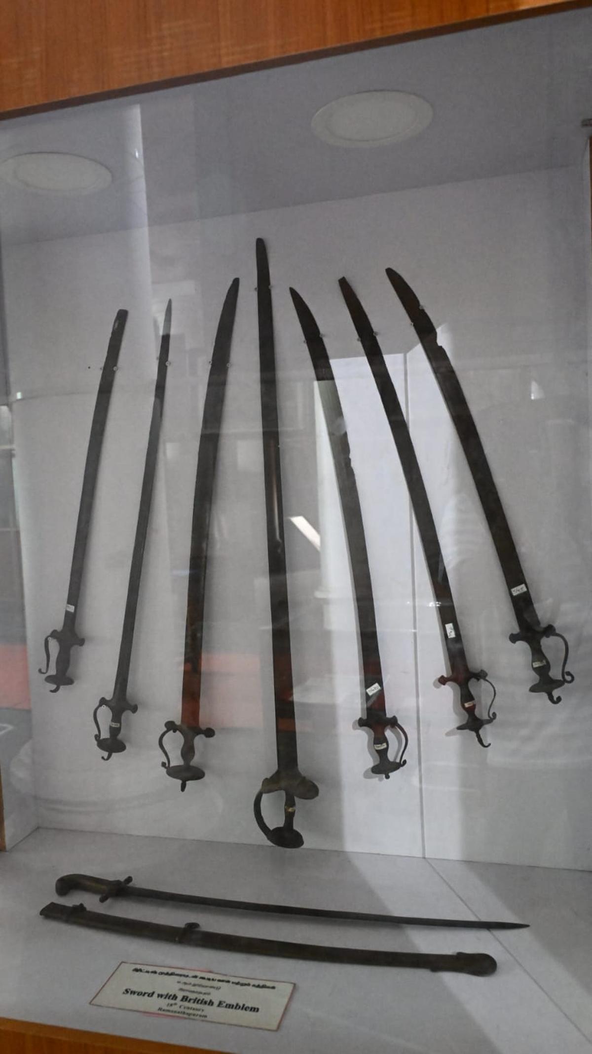 A collection of different kinds of swords with the British emblem engraved on it. Preserved inside a glass closet at Ramalinga Vilas Palace Museum, in Ramanathapuram.