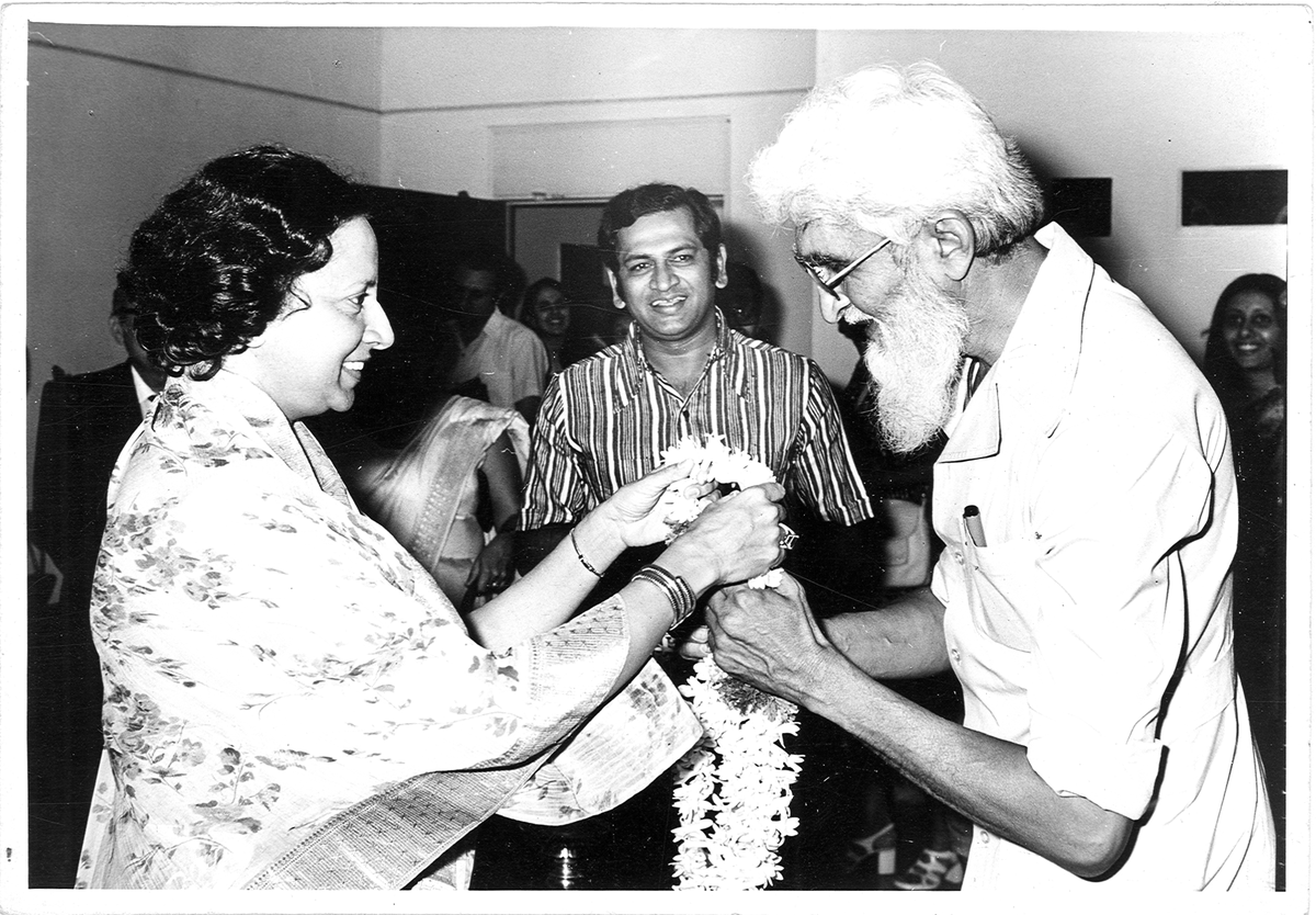Rani Vijaya Devi greeting M.F. Husain at his exhibition for  IMAS in the 1970s. Former Karnataka Chief Minister S.M. Krishna looks on.