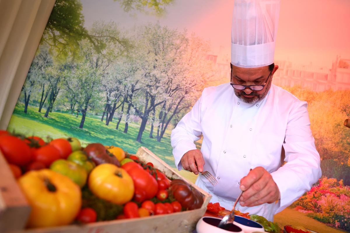 A chef preparing a dish on demand