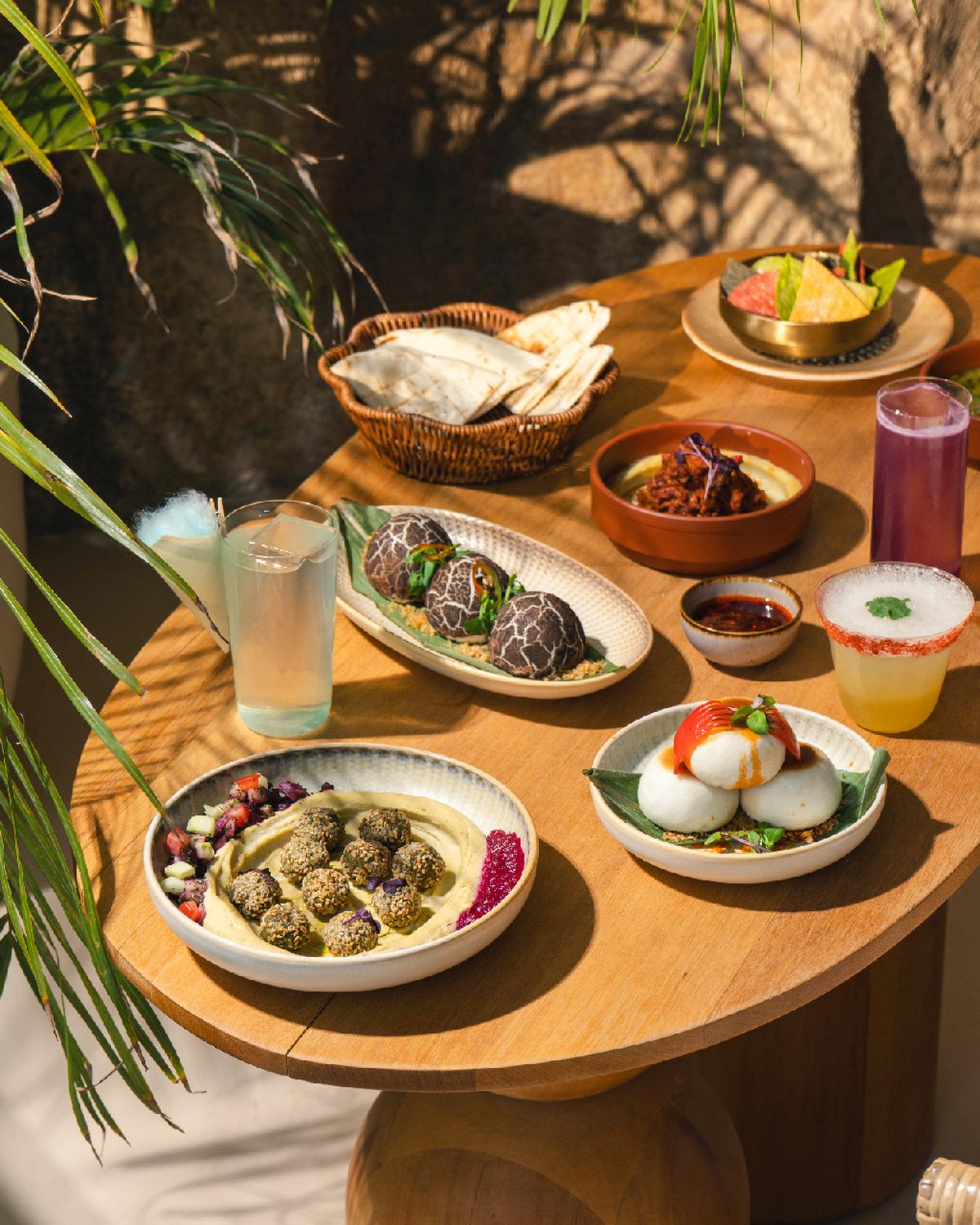 Crispy herb falafel poppers, mushroom bao, and pan seared bao