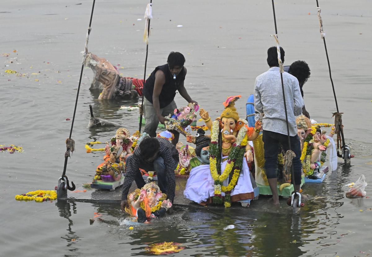 An idol being immersed in Hussainsagar on the fifth day of Ganesh Chaturthi celebrations in Hyderabad on Sunday.