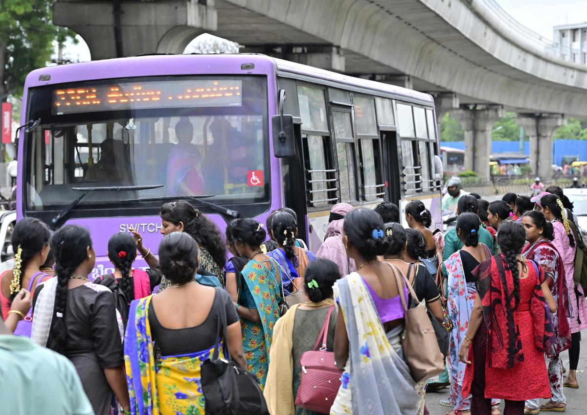 A large number of women, mostly those working in garment factories, waiting at a BMTC bus stand on Mysuru Road in Bengaluru. 