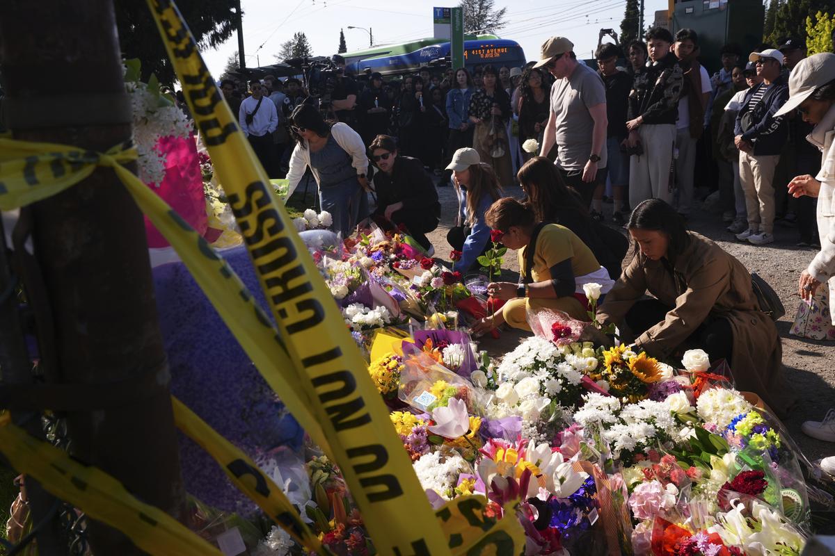 Visitors pay their respects at a memorial after a vehicle drove into a crowd during a Filipino heritage festival in Vancouver, British Columbia, Sunday, April 27, 2025. Visitors pay their respects at a memorial after a vehicle drove into a crowd during a Filipino heritage festival in Vancouver, British Columbia, Sunday, April 27, 2025.
