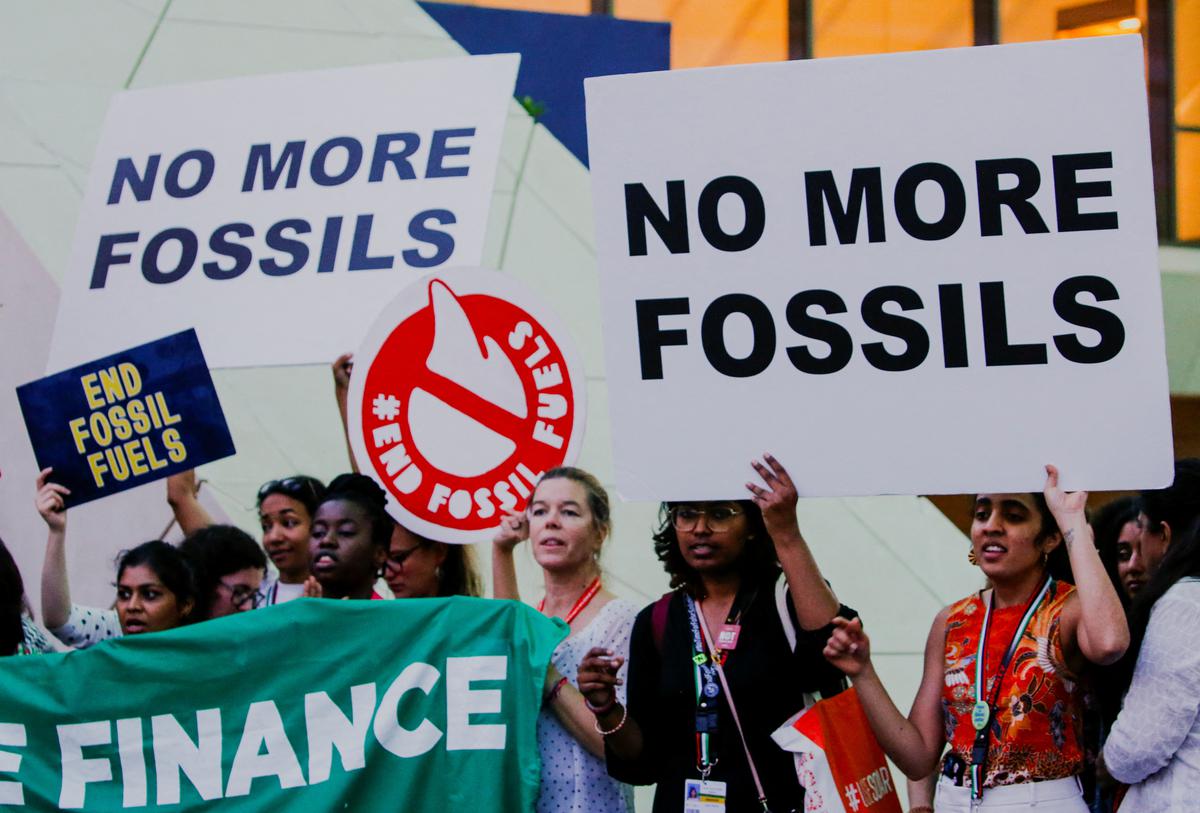 Climate activists protest against fossil fuels at Expo City Dubai during the UN Climate Change Conference COP28 in Dubai, United Arab Emirates.