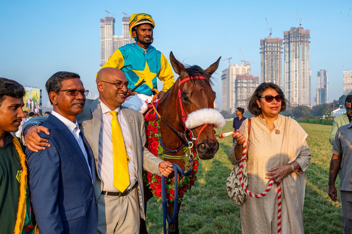 Ameeta Mehra, right, trainer Arjun Manglorkar, third from left, and Allen Singh, second from left, representing Usha Stud Farms leading in the Indian Derby winner Mirra (Antony Raj up) after the win in the Indian Derby at the Mahalaxmi Race Course in Mumbai on February 5, 2023..