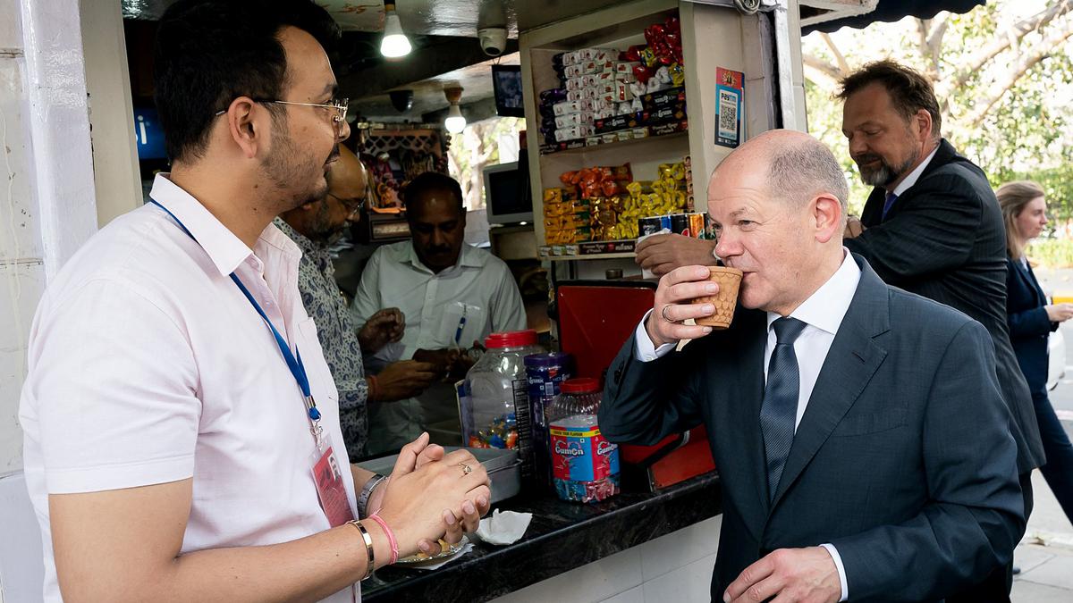 On India visit, German Chancellor Olaf Scholz drinks tea at a street corner in Delhi