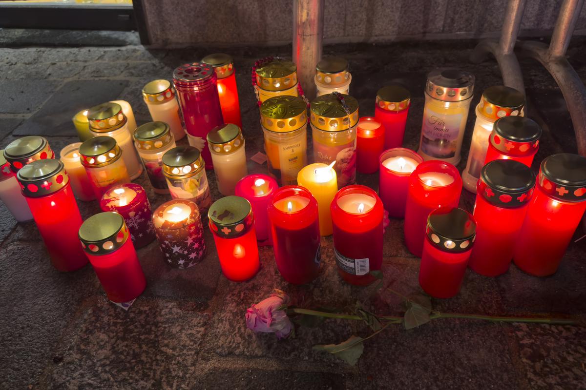 Candles are lit at the site of a stabbing attack in Villach, Austria, on Feb. 16, 2025. 