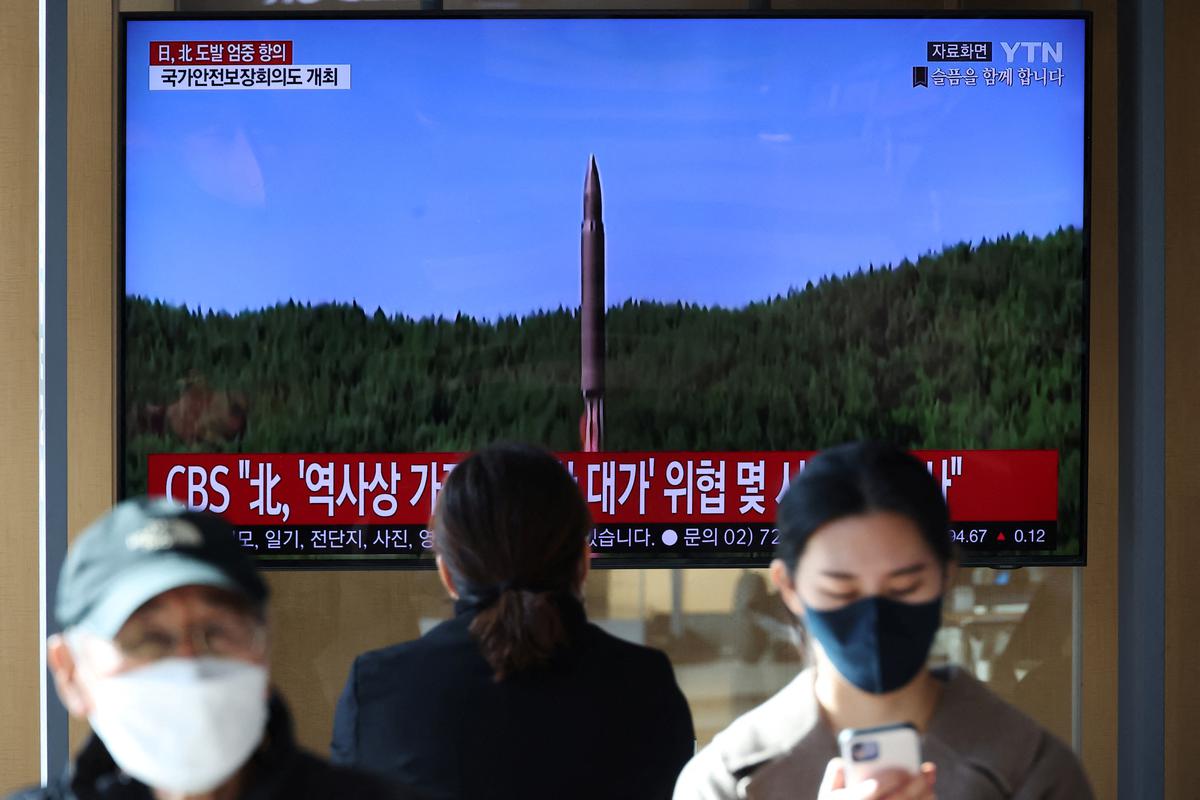 North Korea fires more than 20 missiles, one close to South