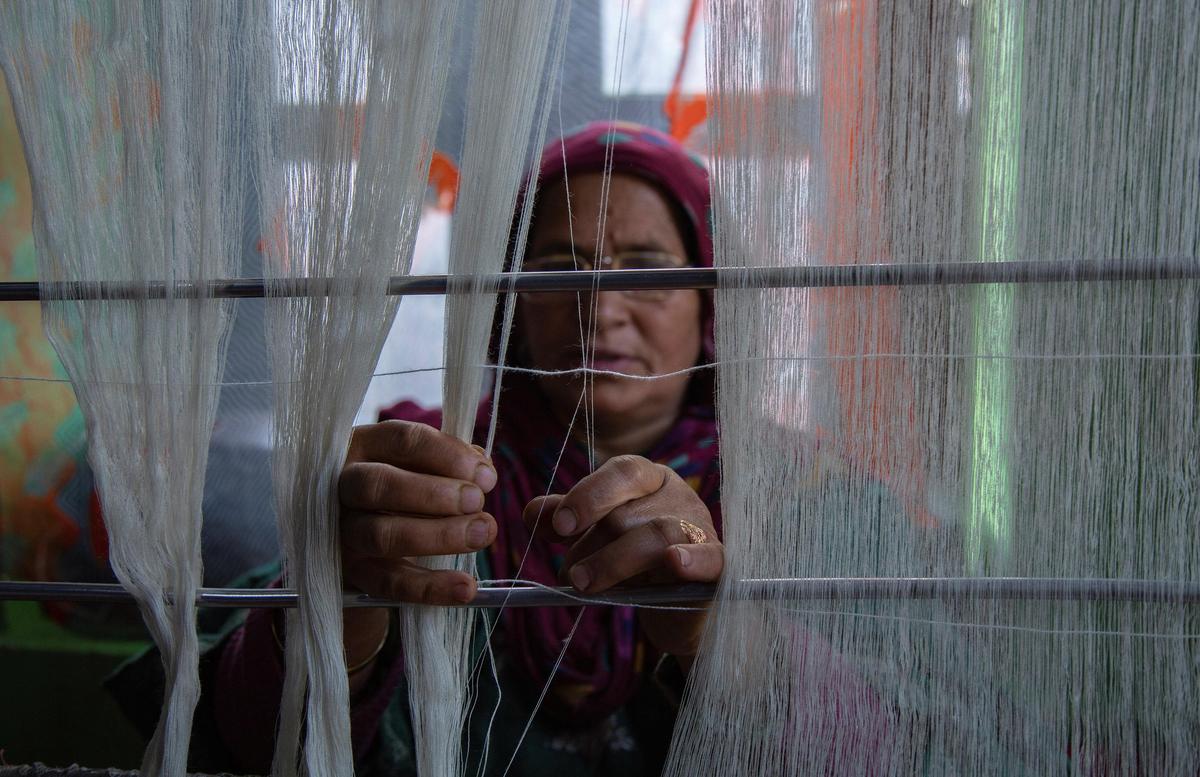Kashmiri women use traditional spinning wheels known as yendir to spin pashmina yarn
