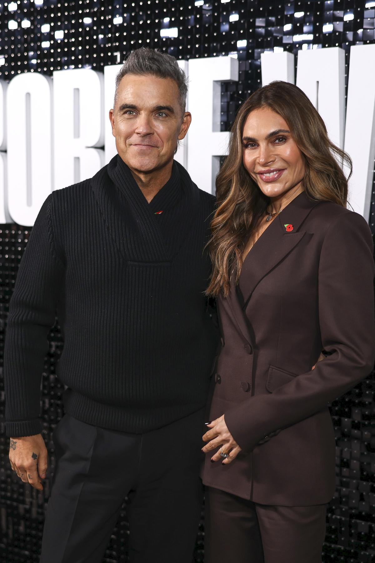 Robbie Williams, left, and Ayda Field pose for photographers upon arrival at the premiere for the ‘Robbie Williams’ documentary