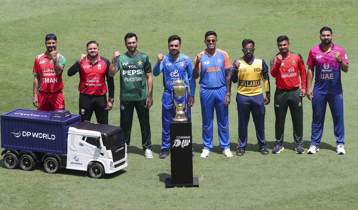 The captains pose with the Asia Cup trophy. The captains pose with the Asia Cup trophy.