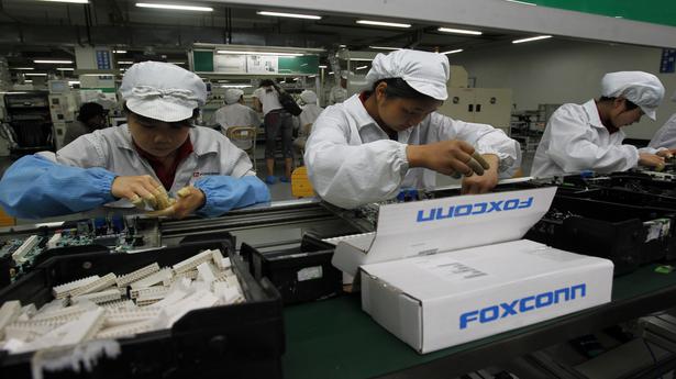 Taiwan weighs Foxconn fine for China chip investment