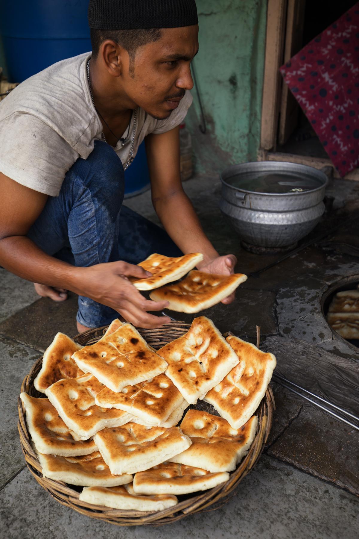 Freshly baked naan out of the oven Freshly baked naan out of the oven