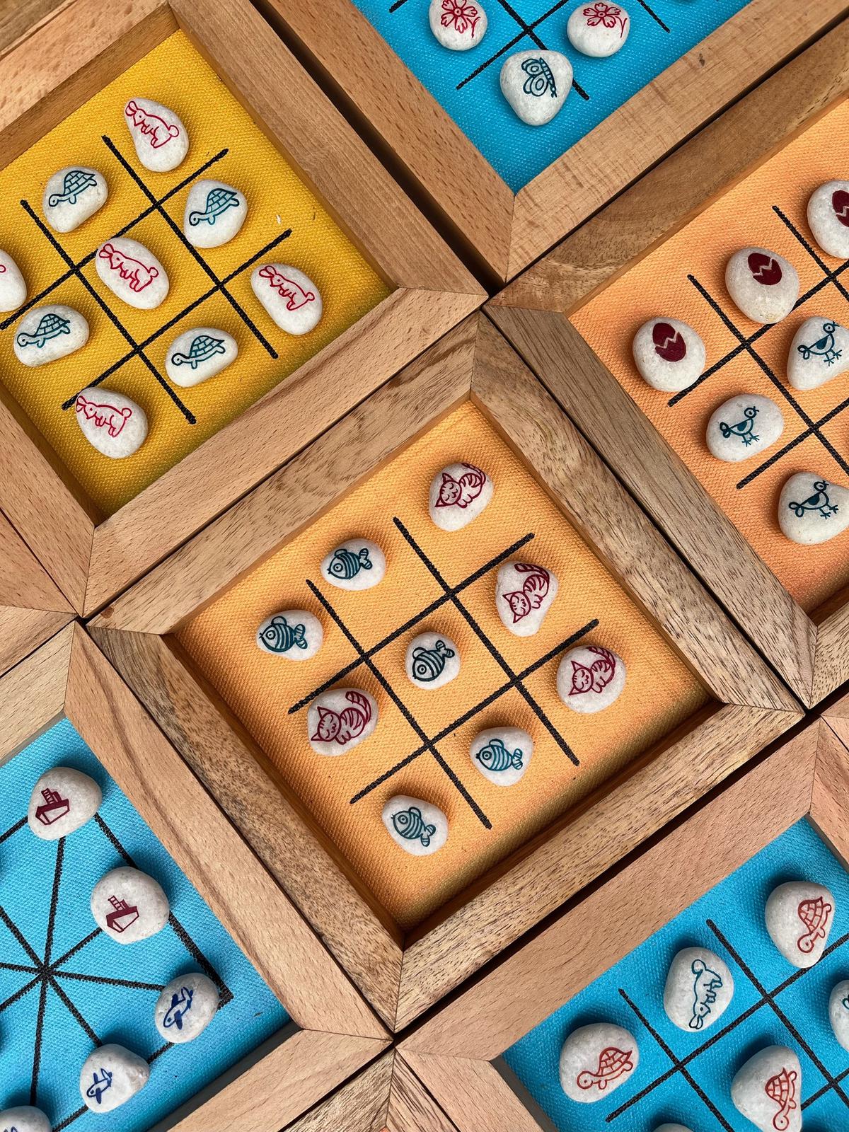 Board game with hand painted stone coins