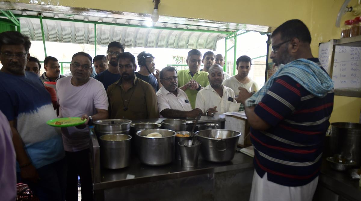 Ramakrishnan serving his customers at his Gomathi Mess, Mandaveli. 