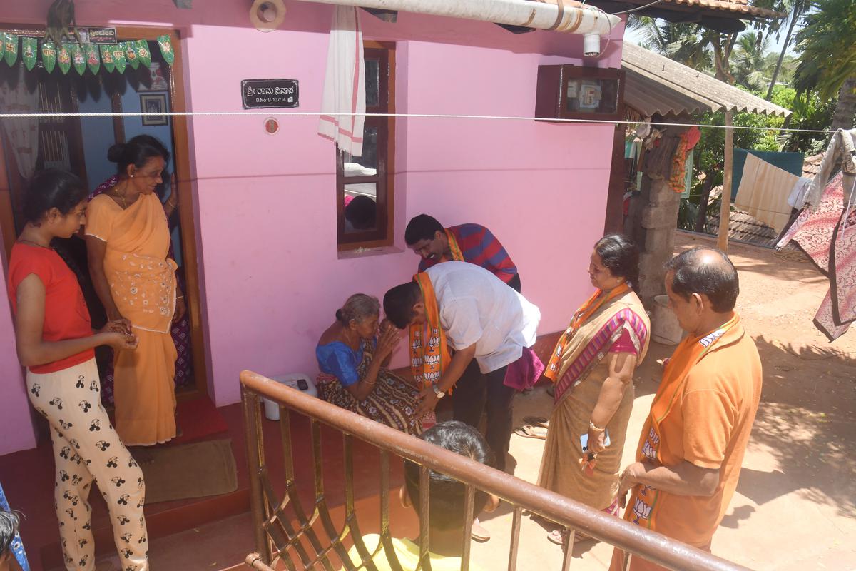 D. Ved Vyas takes blessings from an elderly person at Kamath, Kuntalpady.