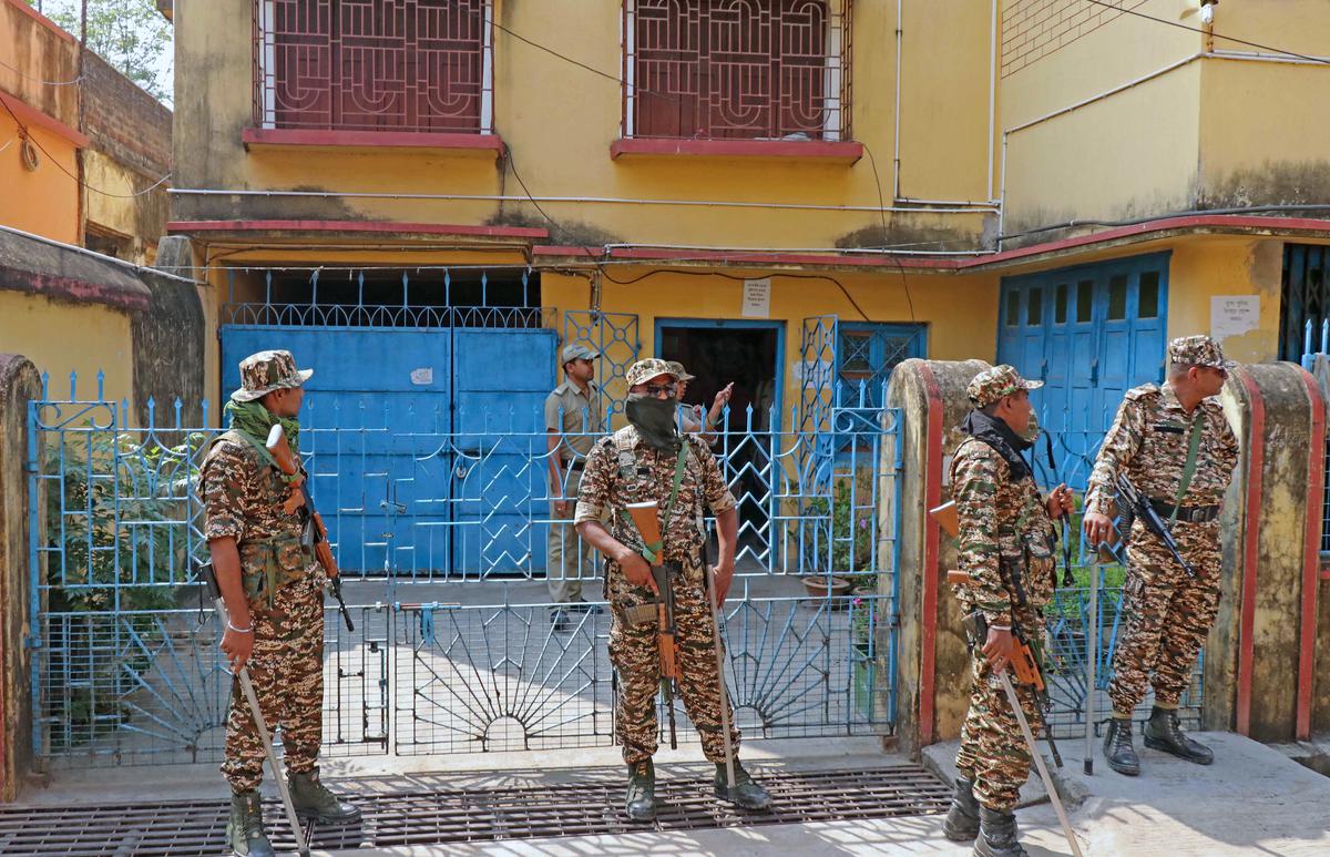 CRP personnel stand guard during a raid by the Enforcement Directorate (ED) at the house of West Bengal Cabinet Minister of MSME and Textiles Chandranath Sinha in connection with teacher recruitment scam at Bolpur in Birbhum district of West Bengal.