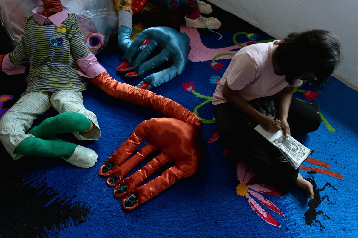 A visitor interacts with the installation ‘Hush’