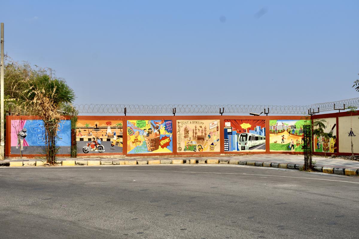 A wall near the old airport road painted with murals 