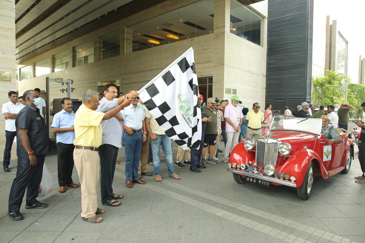 Cars being flagged off for the rally