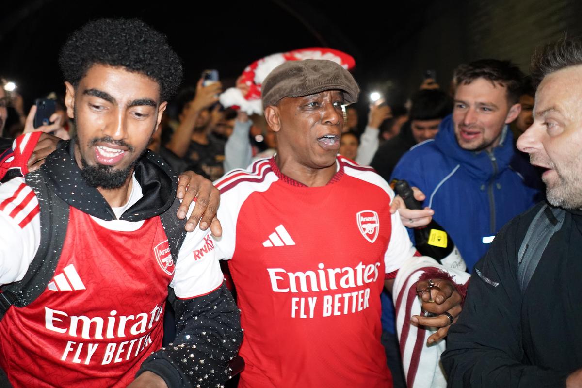 Former Arsenal player Ian Wright arrives at the Arsenal stadium to celebrate with supporters