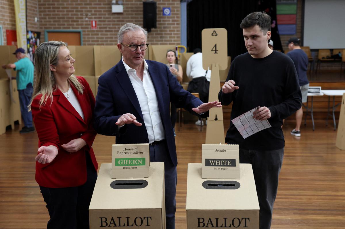 Australia’s Prime Minister Anthony Albanese reacts alongside his partner Jodie Haydon and his son Nathan Albanese as he votes at a polling station in Grayndler during the Australian federal election, in Sydney, Australia, May 3, 2025.
