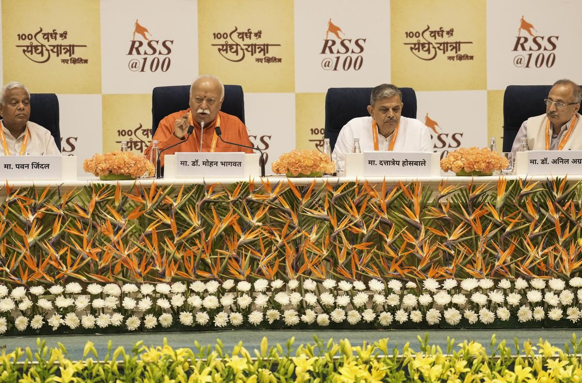 Mohan Bhagwat (second from left), who turns 75 on September 11, spoke for more than four hours over three days, and answered questions at a recent event in New Delhi. The RSS will mark its 100th anniversary in October. Mohan Bhagwat (second from left), who turns 75 on September 11, spoke for more than four hours over three days, and answered questions at a recent event in New Delhi. The RSS will mark its 100th anniversary in October.