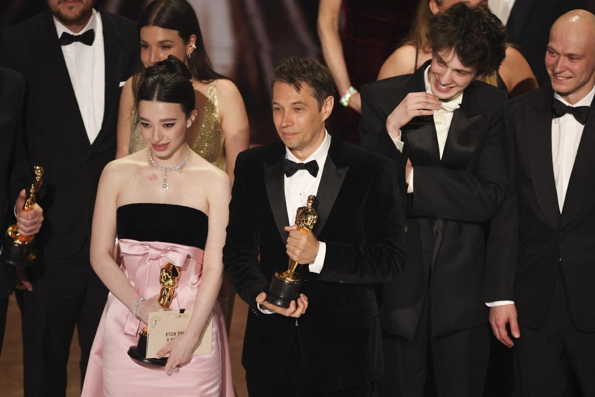 Mark Eydelshteyn, Yura Borisov and Best Actress winner Mikey Madison stand with director Sean Baker onstage after “Anora” won Best Picture Award during the Oscars show at the 97th Academy Awards in Hollywood, Los Angeles, California, U.S., March 2, 2025.