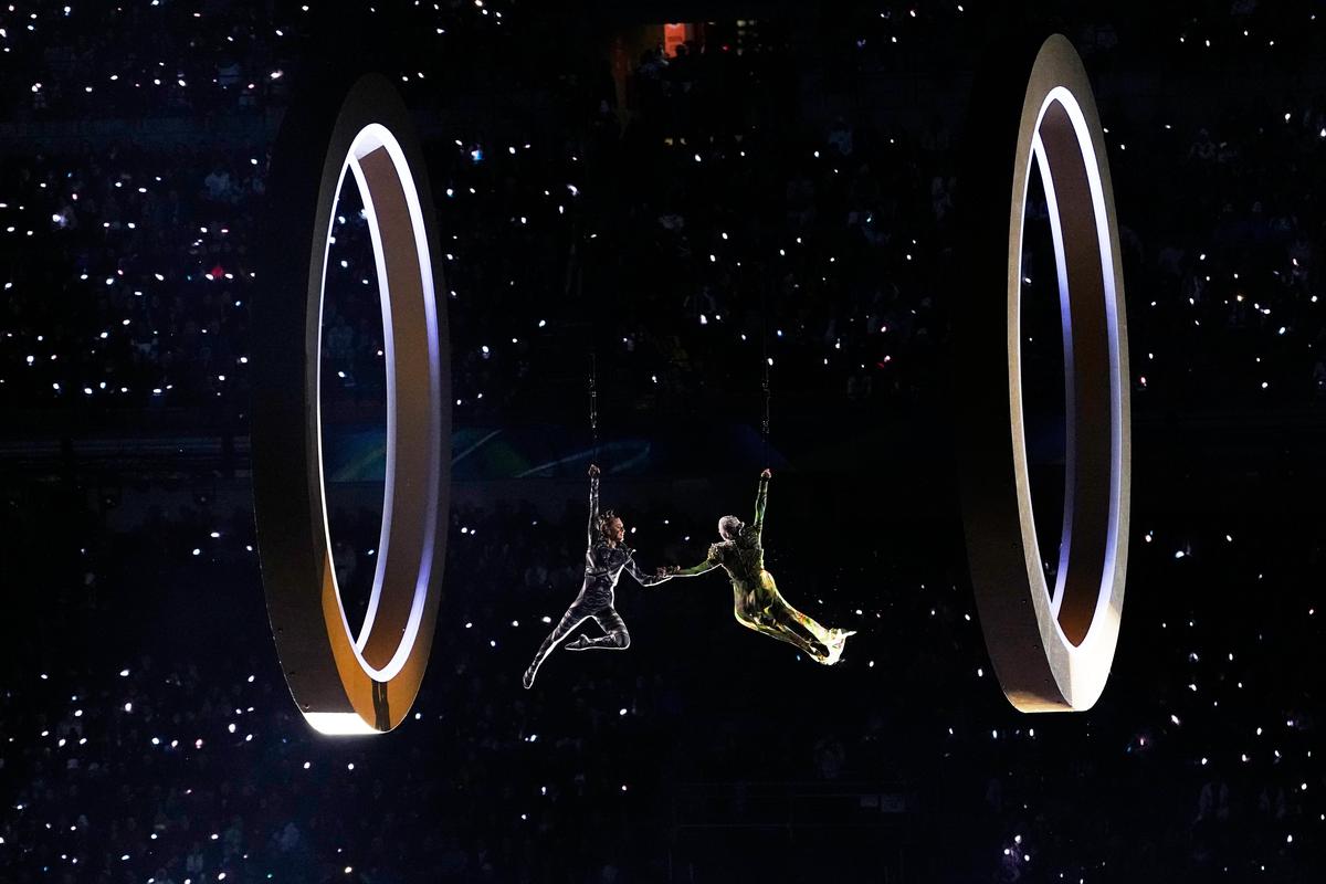 Artists perform during the Olympic opening ceremony at the 2026 Winter Olympics, in Milan, Italy, on February 6, 2026
